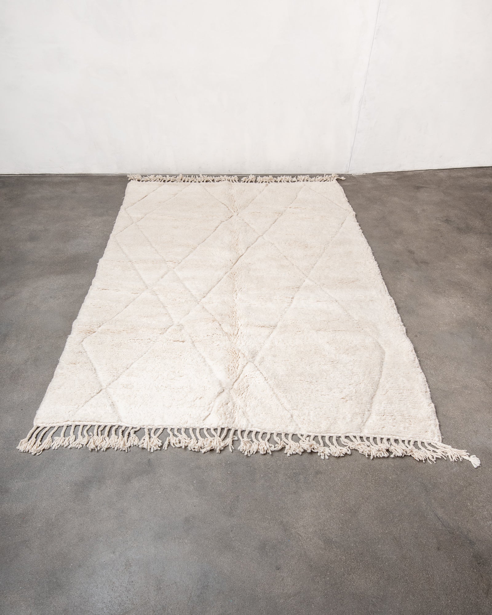 Modern, designer, handcrafted Berber rug from Morocco. Beniourain carpet with minimalist design, natural wool pile and a fluffy texture.